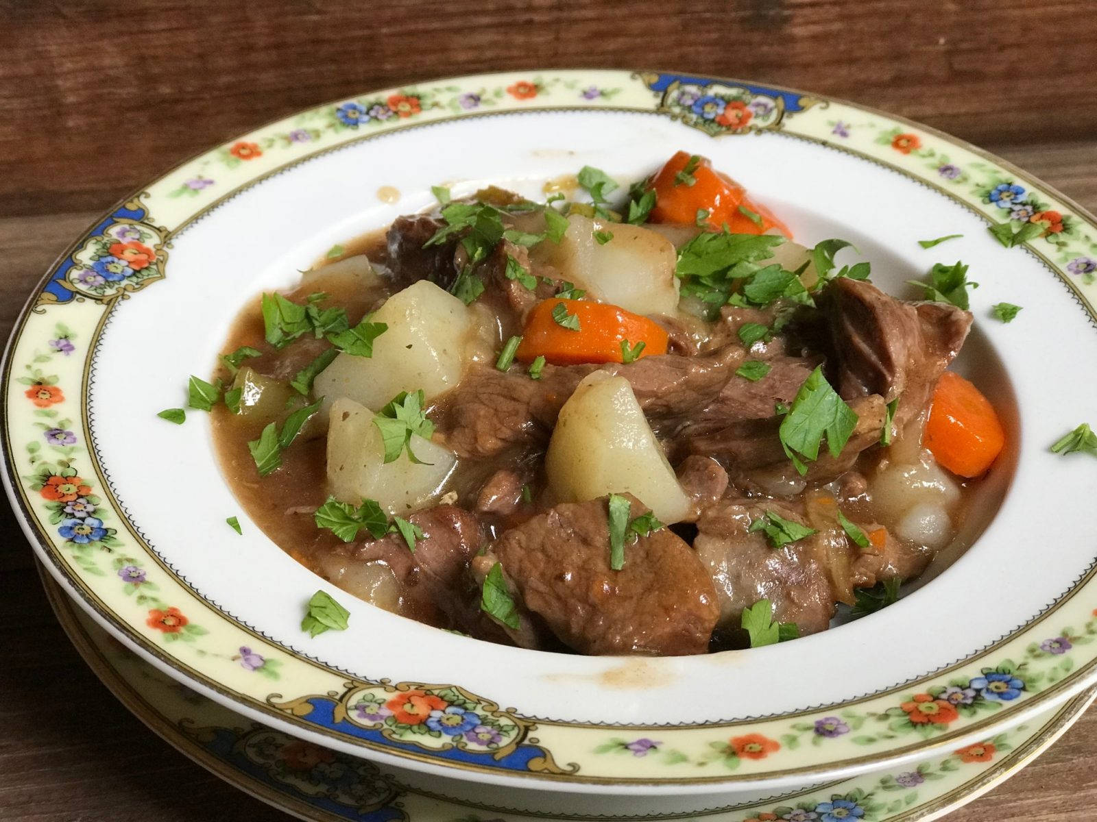 Succulent Beef Bourguignon Served With Potatoes Wallpaper