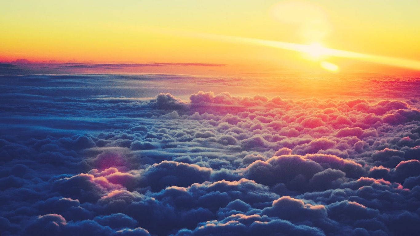 Sunrise Above Clouds Wallpaper