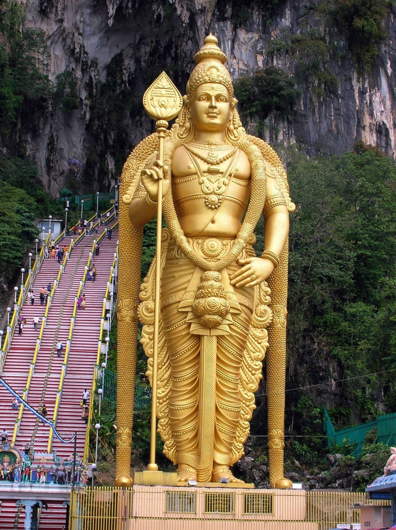 Tall Golden Murugan Statue Wallpaper
