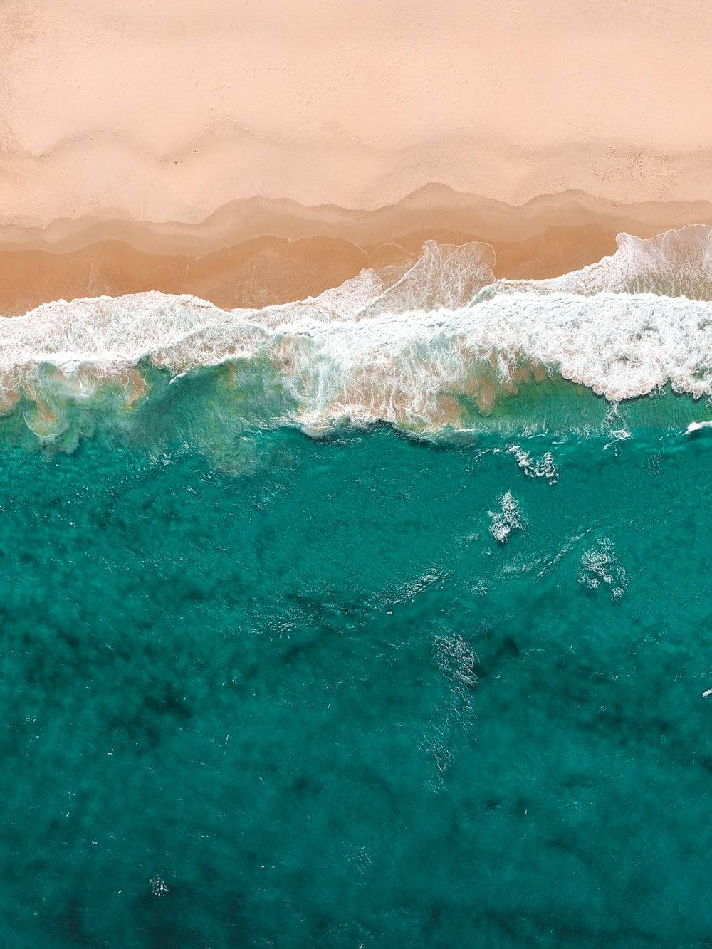 Teal Ocean Waves And Sand Wallpaper