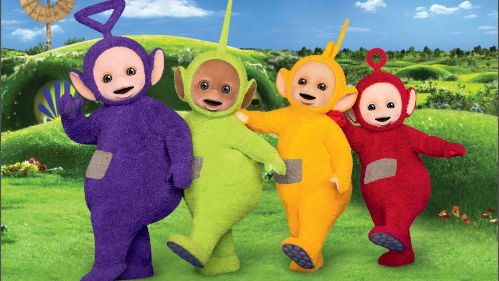 Teletubbies Dancing Happily Together Wallpaper