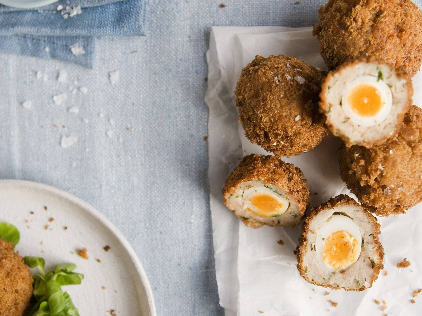 Tempting Scotch Eggs On White Plate Wallpaper