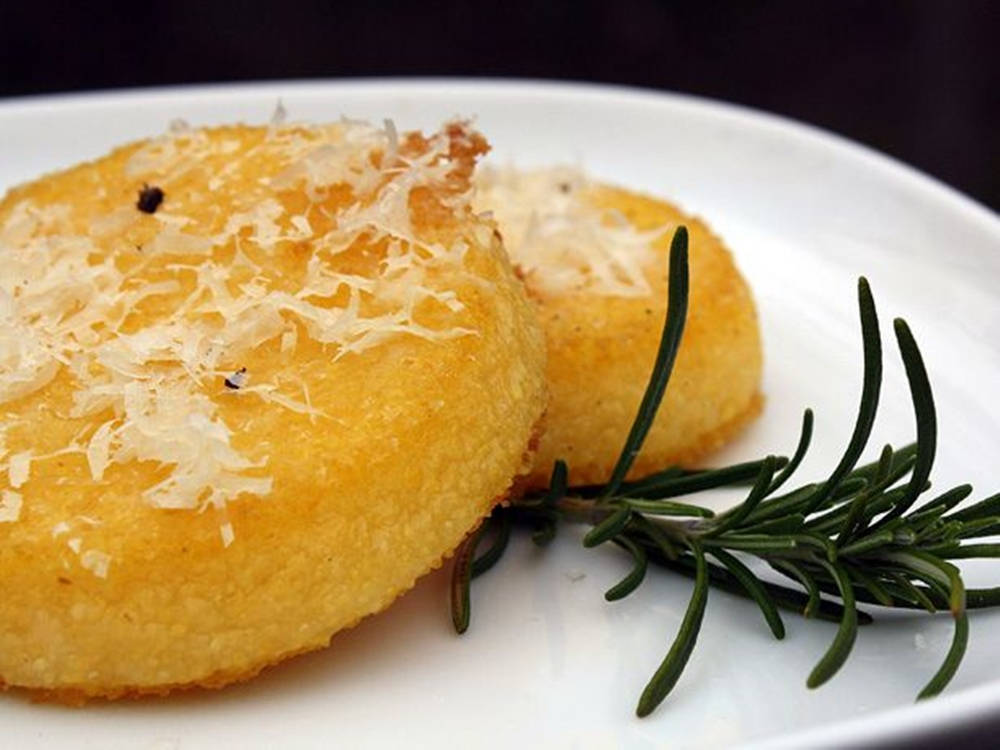 Temptingly Tasty Round Polenta Cakes Freshly Made. Wallpaper