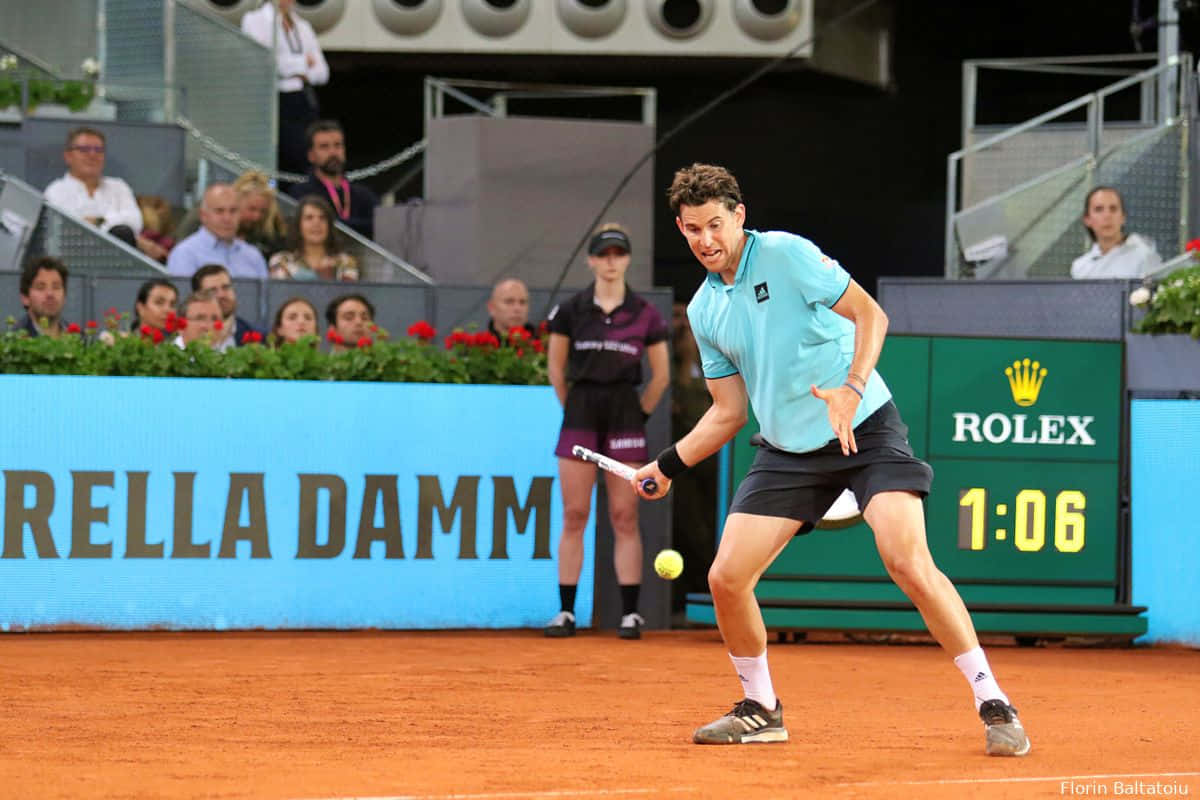 Tennis_ Player_ Backhand_ Shot_on_ Clay_ Court Wallpaper