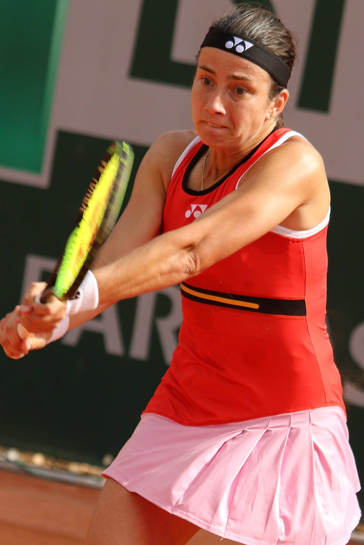 Tennis Star Anastasija Sevastova Holding Her Racket Ready On Court Wallpaper