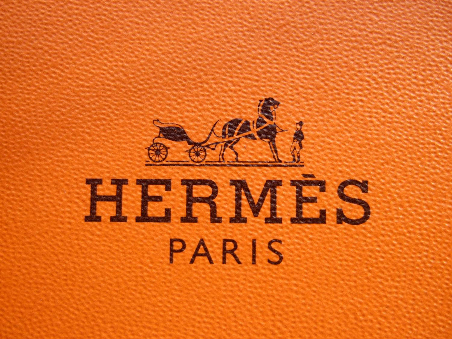Textured Orange Hermes Logo Wallpaper