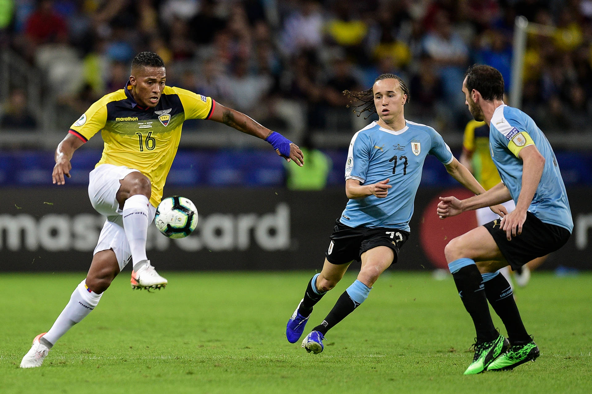 The Ecuador National Football Team In Action Against Argentina Wallpaper