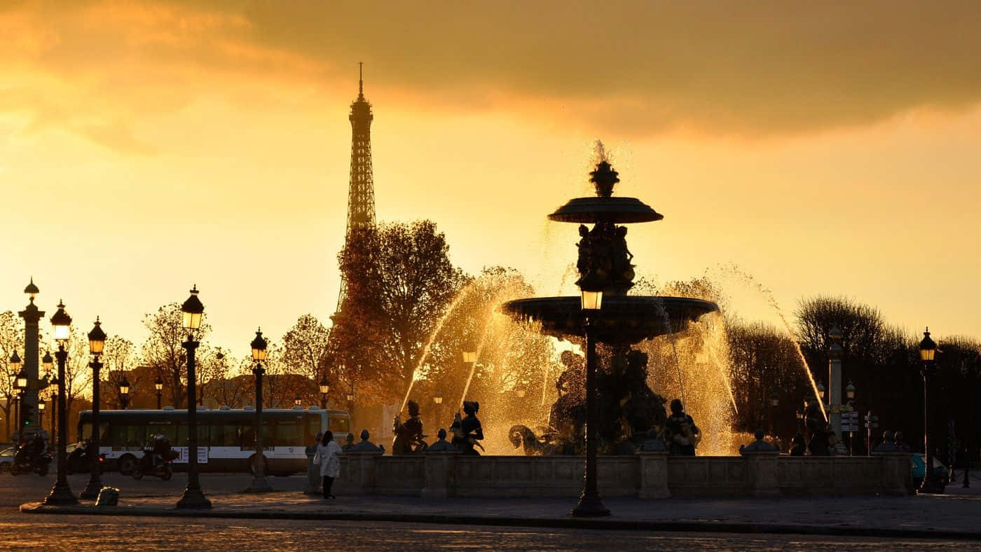 The Eiffel Tower Stands Over The City Of Lights Wallpaper