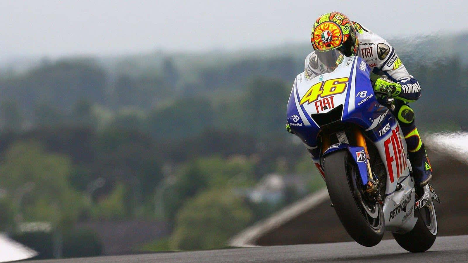 The Master Of Racing - Vr46 Riding A Yamaha 500cc Motorcycle Wallpaper