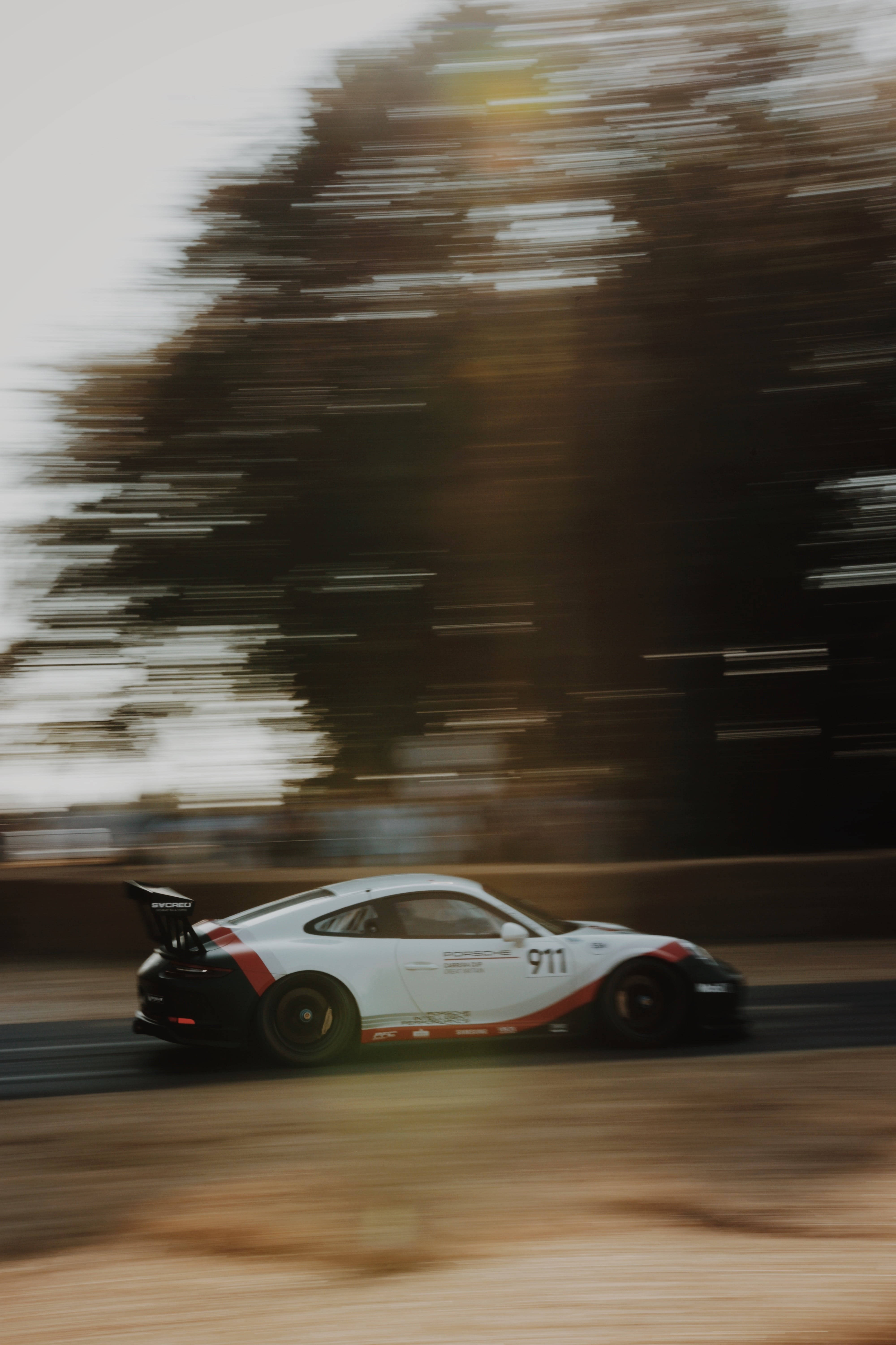 The Need For Speed – White Racecar In Action On Iphone Wallpaper Wallpaper