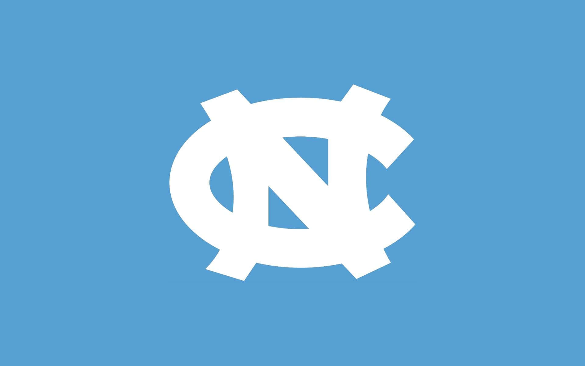 The North Carolina Tar Heels Logo On A Blue Background Wallpaper