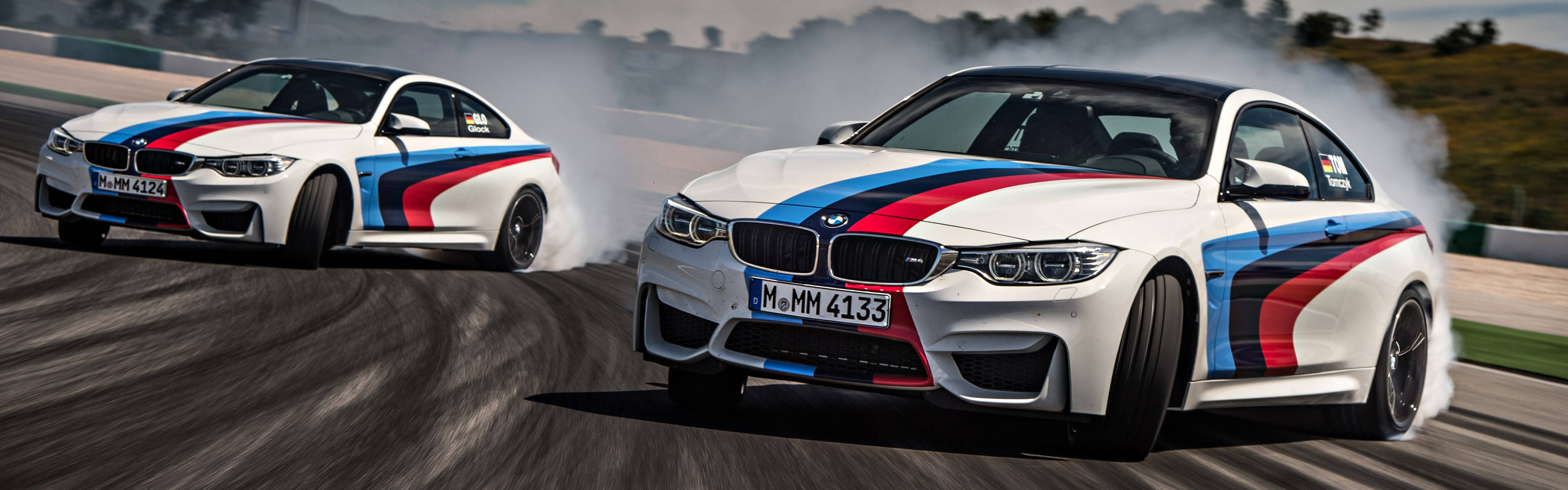 The Thrilling Ride Of A Bmw M4 Drift Car On The Track Wallpaper