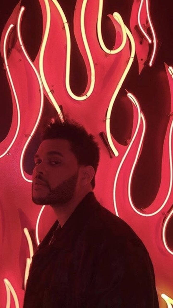 The Weeknd Posing In Red Flames Wallpaper