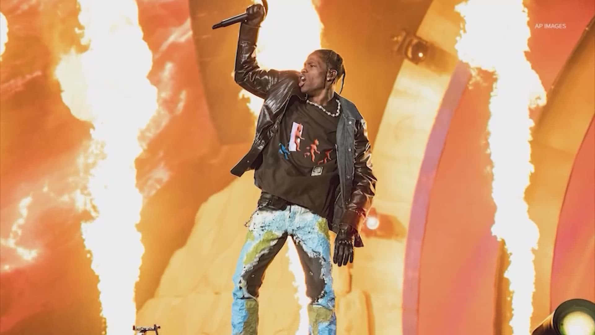 Thousands Of Fans Join In Person And Online To Experience Travis Scott's Electrifying Concert Wallpaper