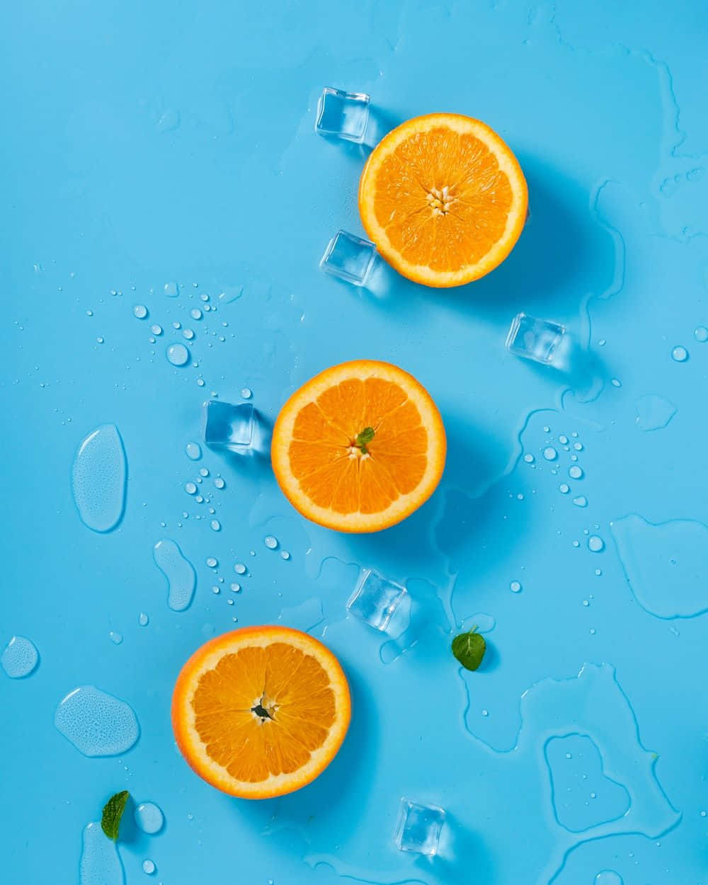 Three Cute Orange Slices With Ice Wallpaper