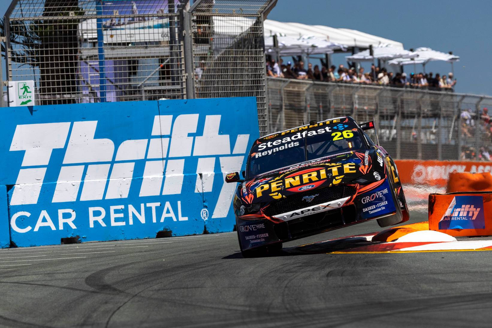 Thrifty Car Rental Logo On Race Track Wallpaper