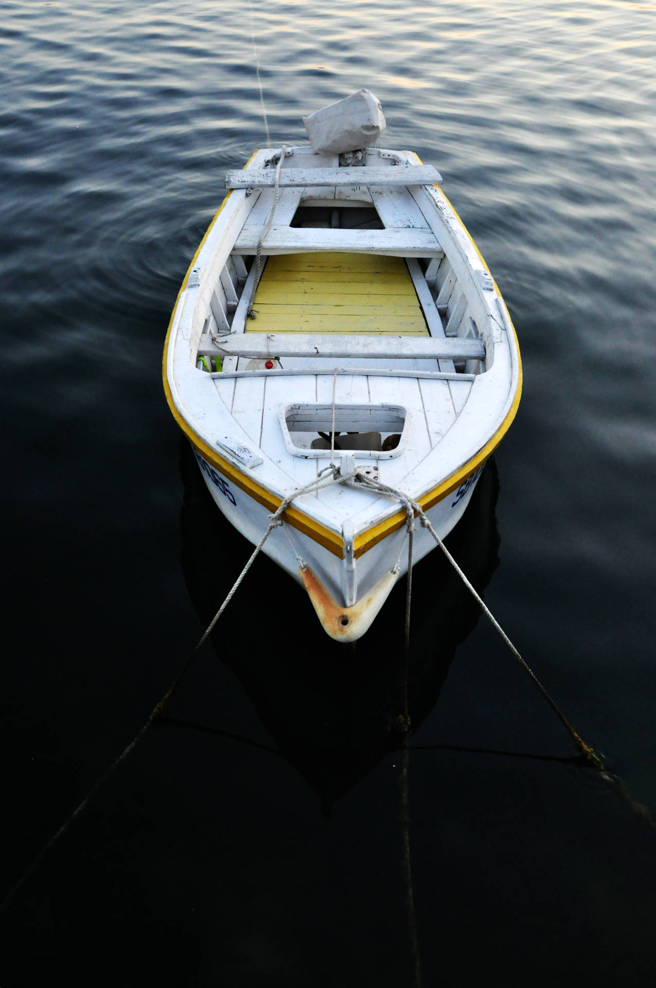 Download free Tied Boat On Dark Water Wallpaper 