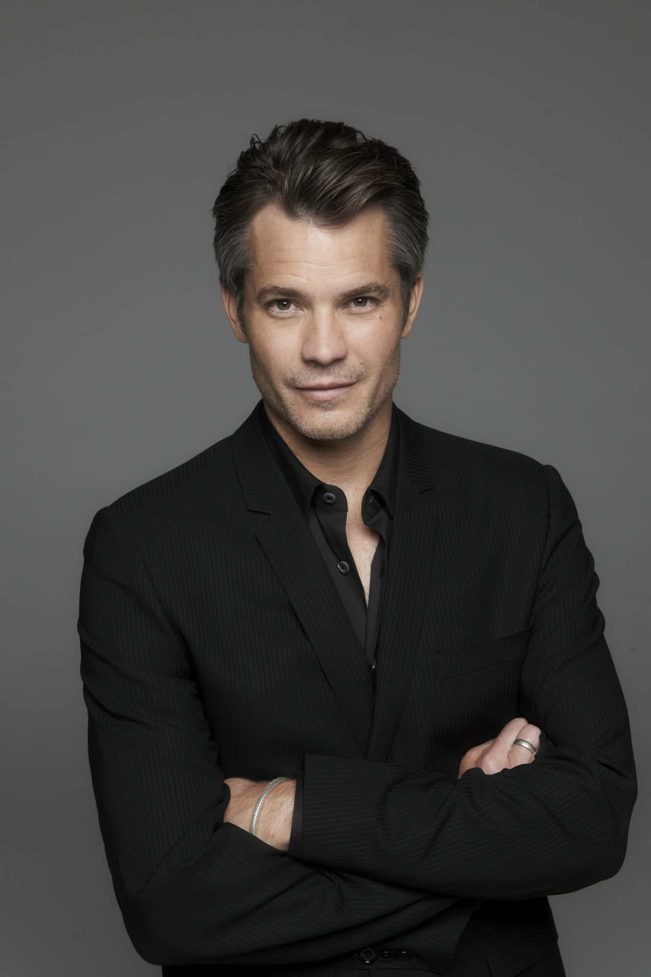 Timothy Olyphant Striking A Confident Pose Wallpaper