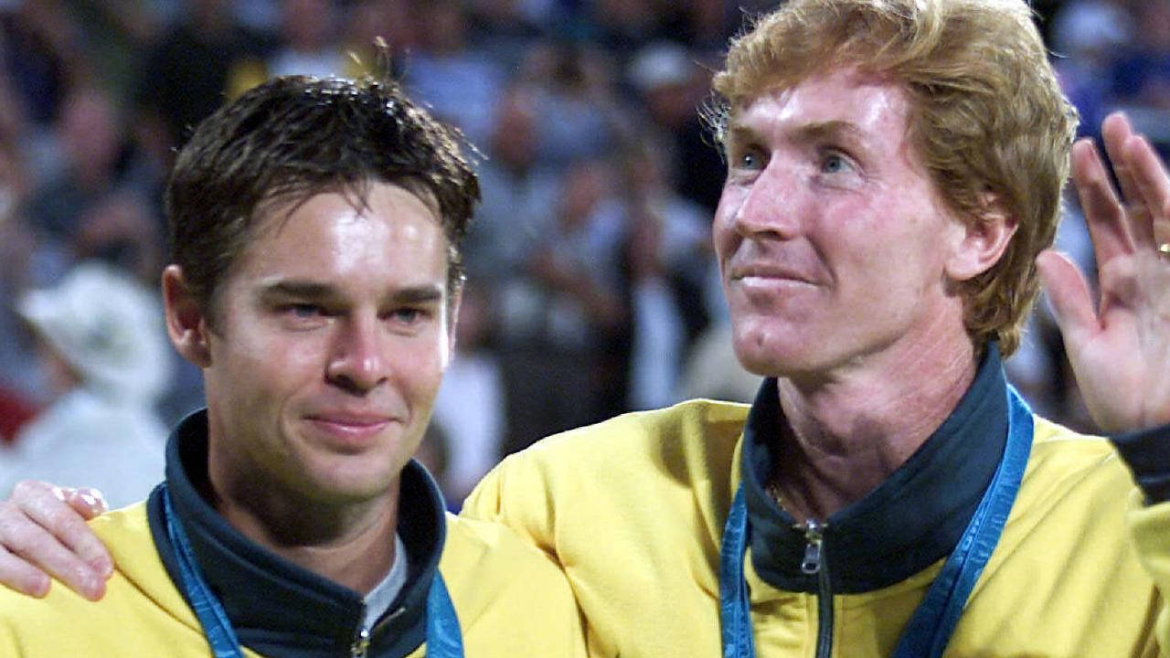 Todd Woodbridge Holding The Winning Trophy Of Team Australia Wallpaper