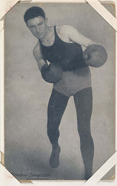 Tommy Loughran In Punching Pose Wallpaper