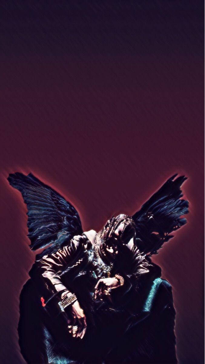 Travis Scott Astroworld Sitting With Butterfly Wings Wallpaper