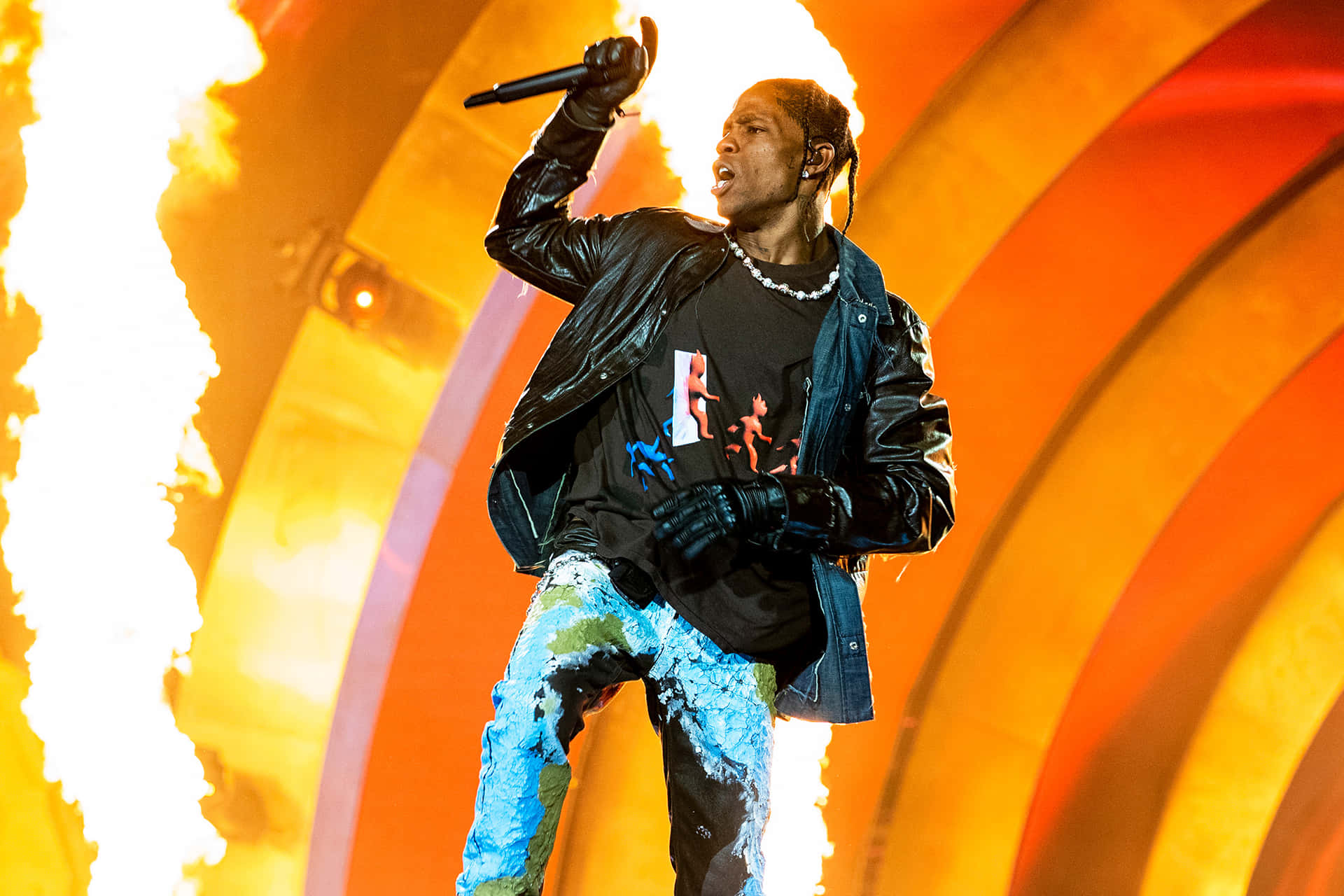 Travis Scott Performing On Stage Wallpaper