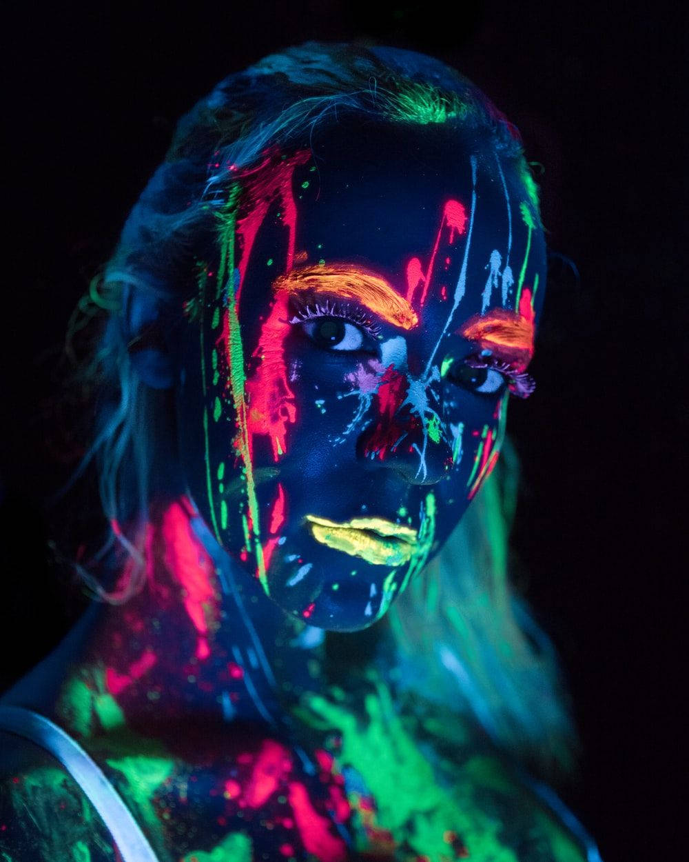 Trippy Dark Girl With Neon Paint Wallpaper