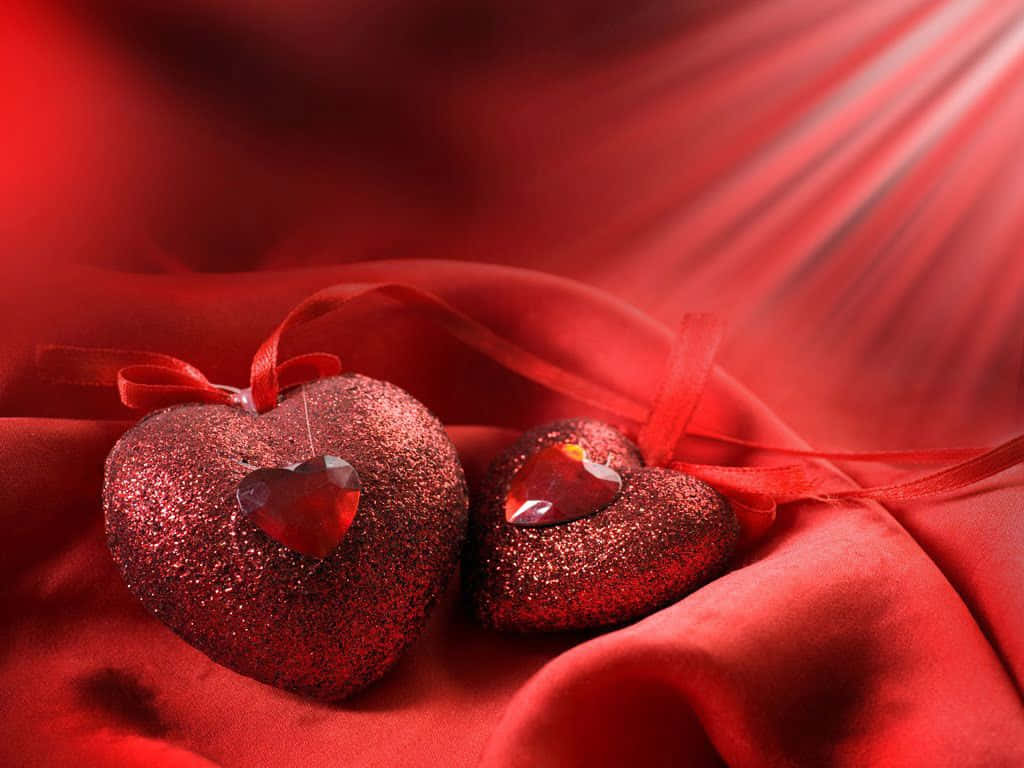 Two Red Hearts On A Red Background Wallpaper