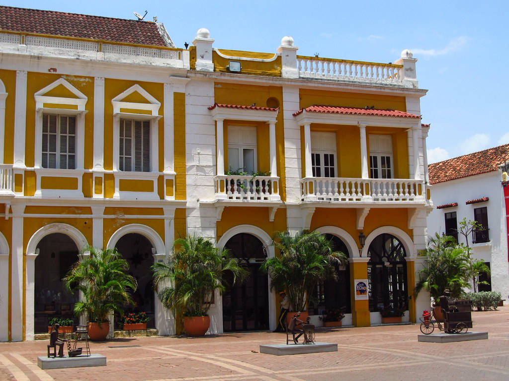 Vibrant Yellow Building In Lively Cartagena Wallpaper