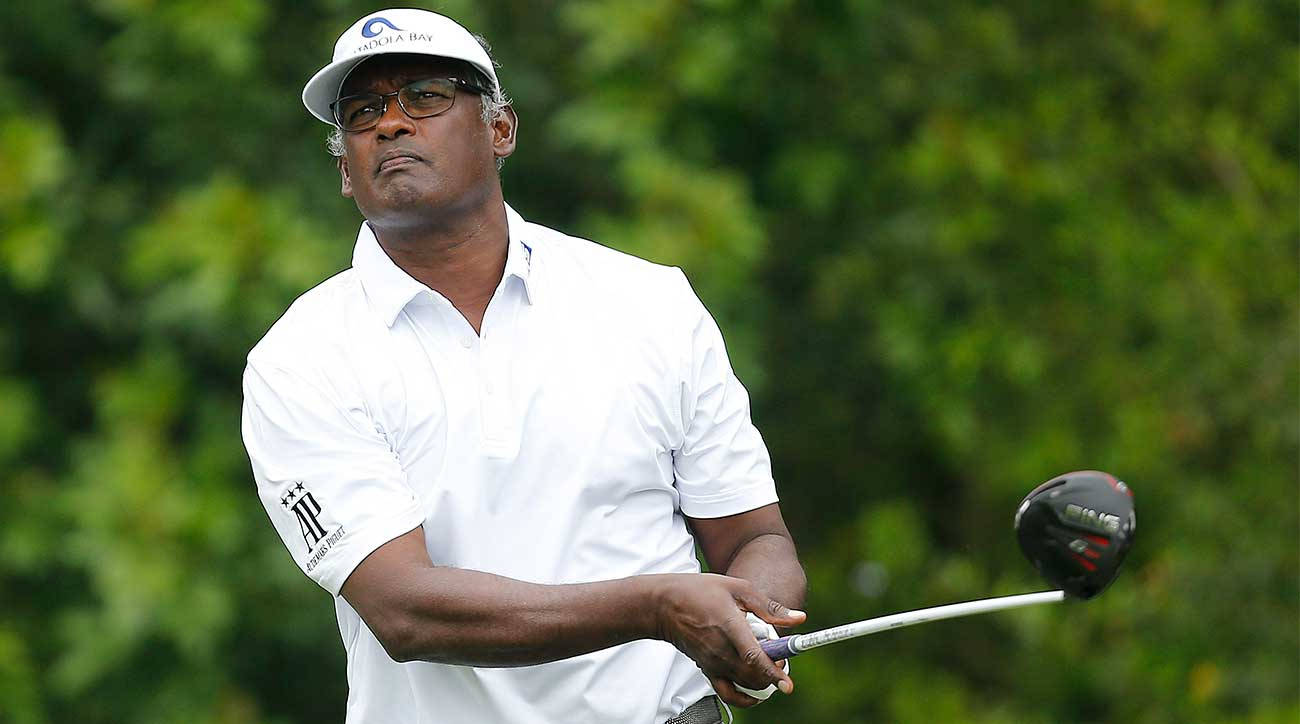 Vijay Singh Holding Out Golf Club Wallpaper