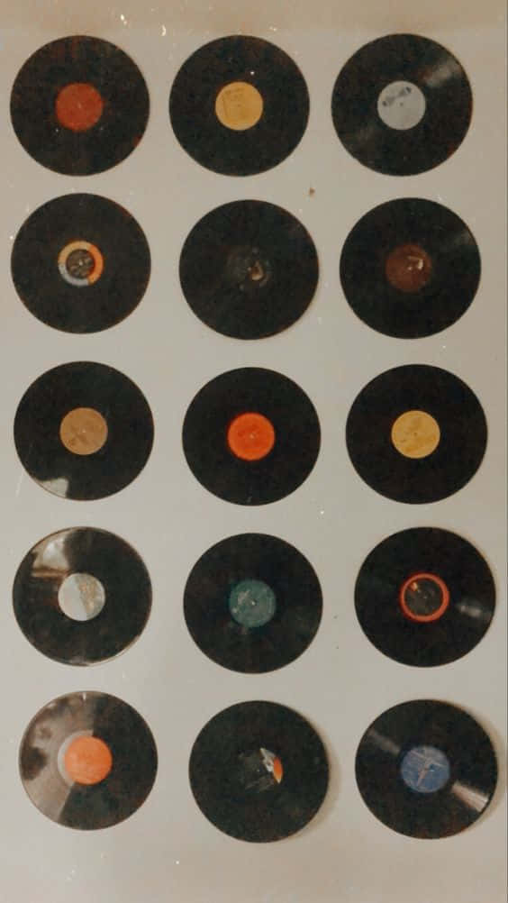 Vinyl Record Collection On A Wall Wallpaper