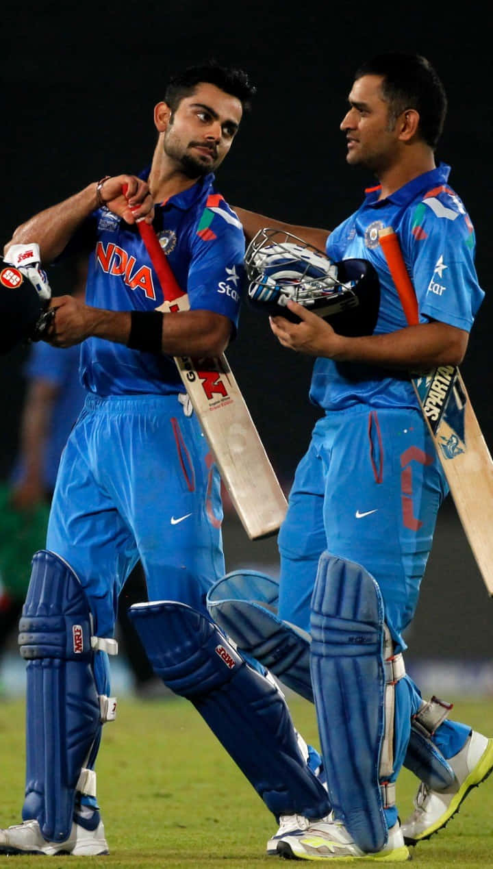 Virat_ Kohli_and_ Teammate_ Candid_ Moment_ Cricket_ Field Wallpaper