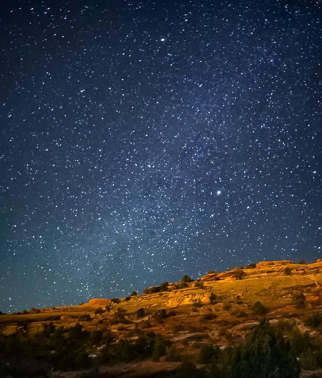 Visible Stars Over Mountainside Wallpaper