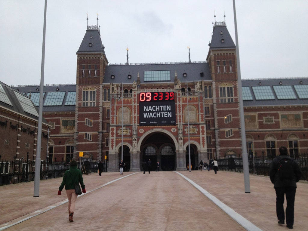 Visitors Exploring The Rijksmuseum Entrance Wallpaper