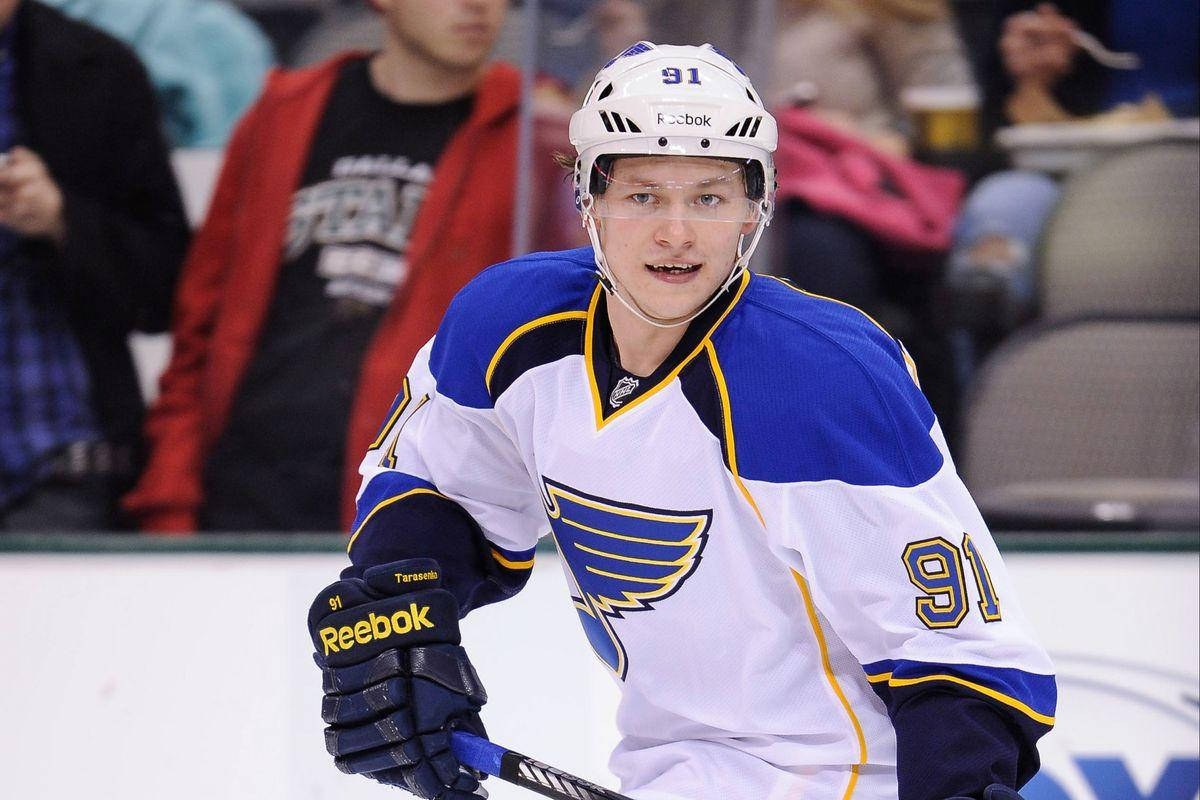 Vladimir Tarasenko Wearing White Jersey And Holding Hockey Stick Wallpaper