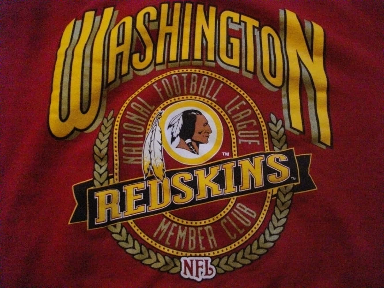 Washington Football Team Players In Action During A Thrilling Game Wallpaper
