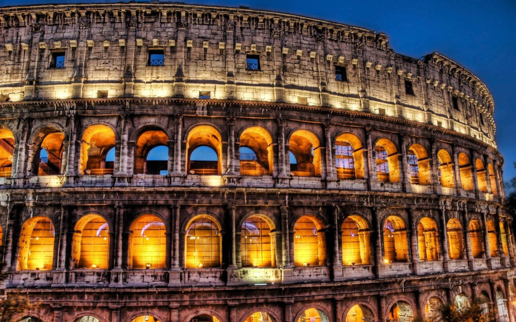 Well-lit Colosseum At Night Desktop Wallpaper