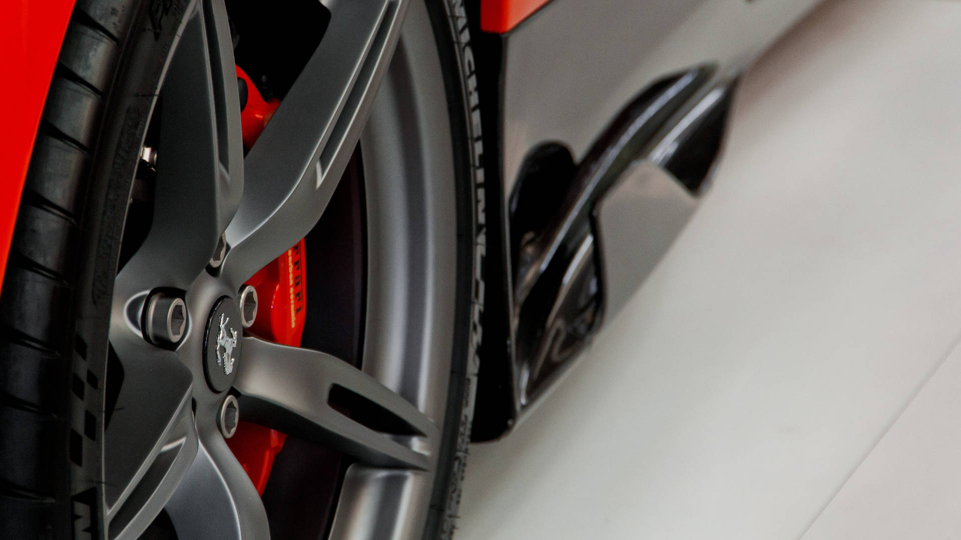 Wheel Of A Ferrari Ipad Wallpaper