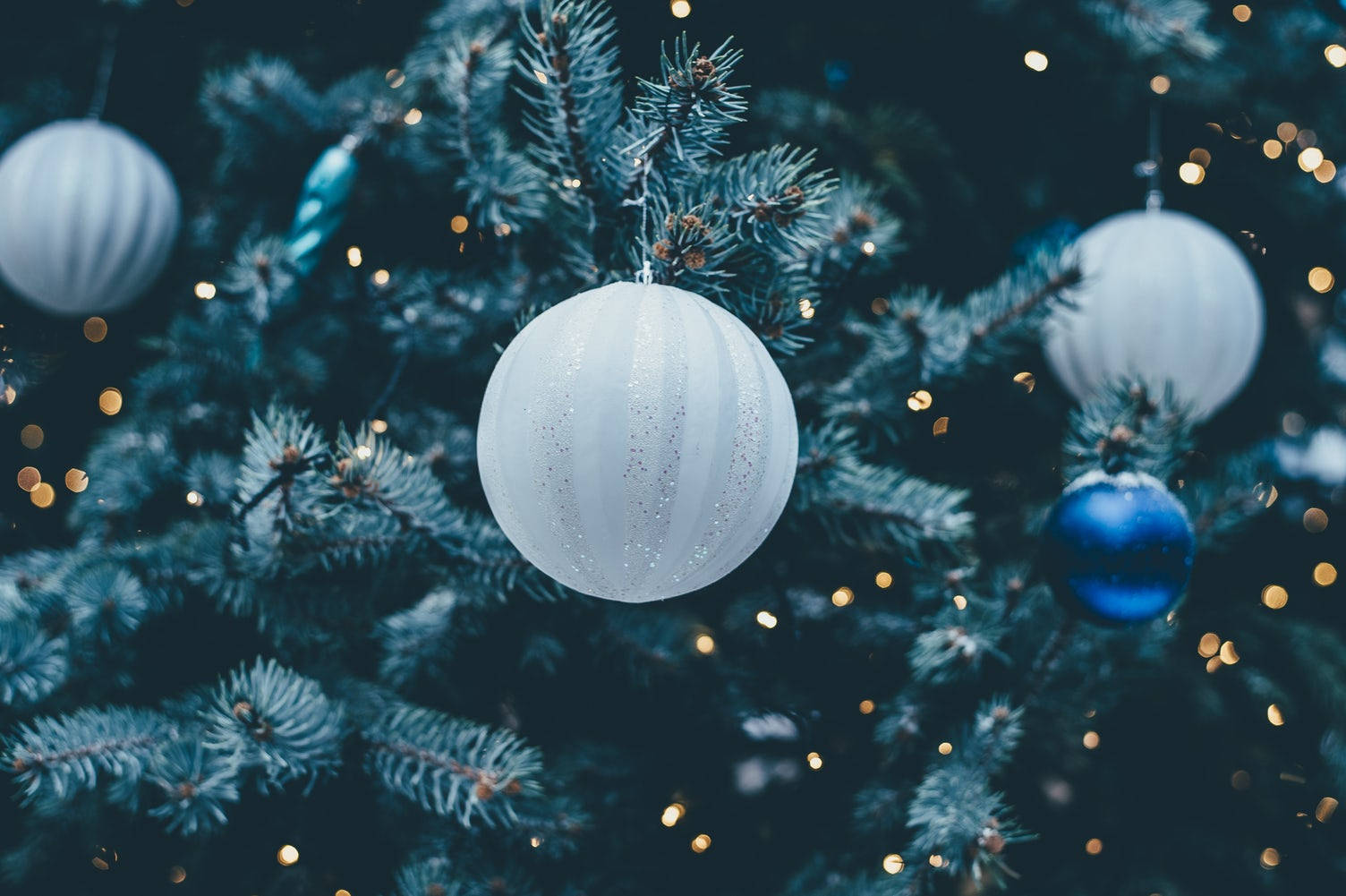 White Christmas Ball On Festive Tree Tight Shot Wallpaper