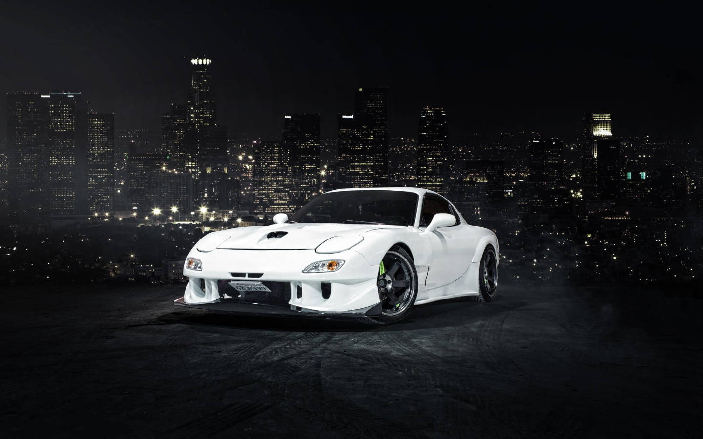 White Mazda Rx7 Overlooking City Wallpaper