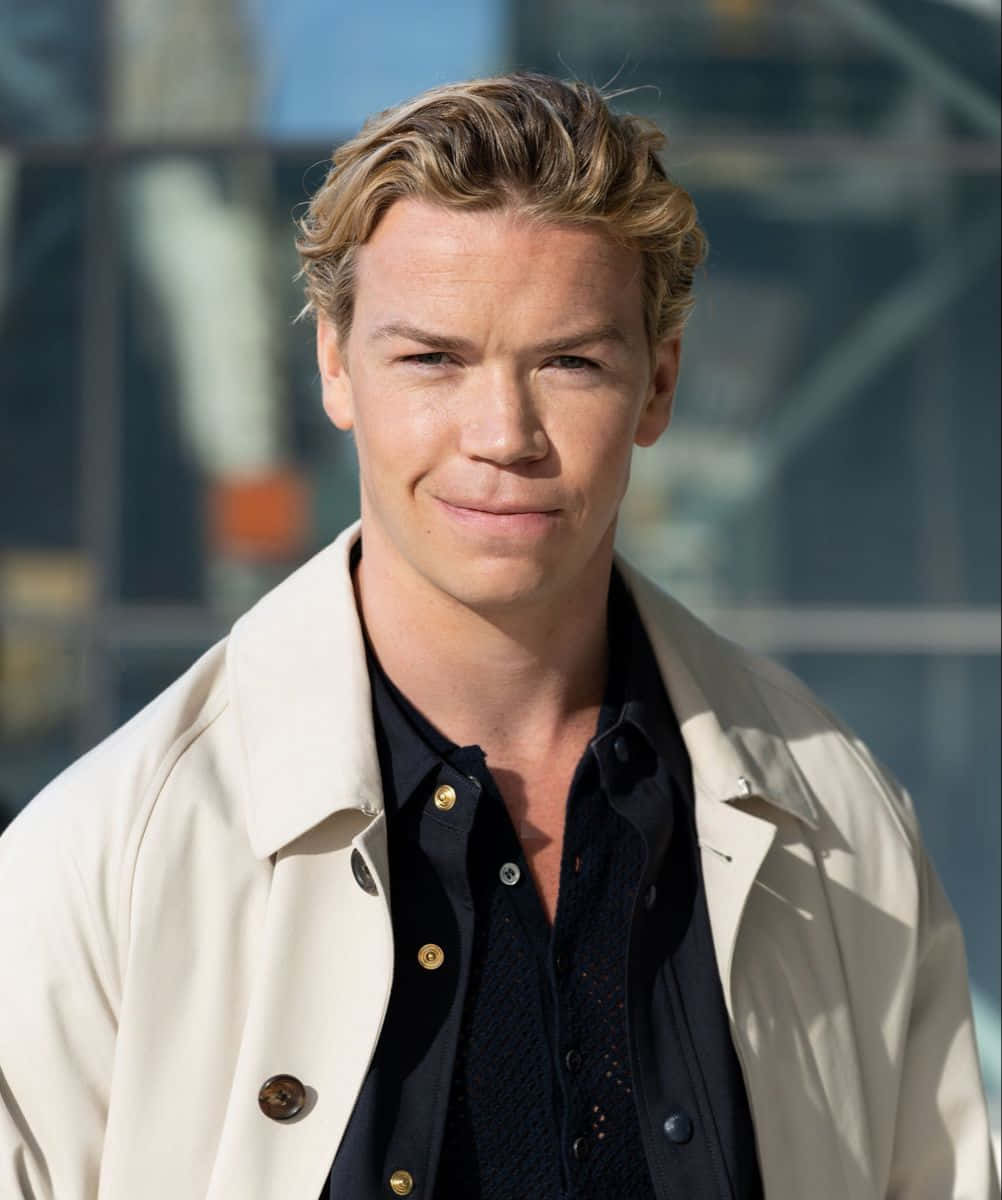 Will Poulter Smilingin Trench Coat Wallpaper