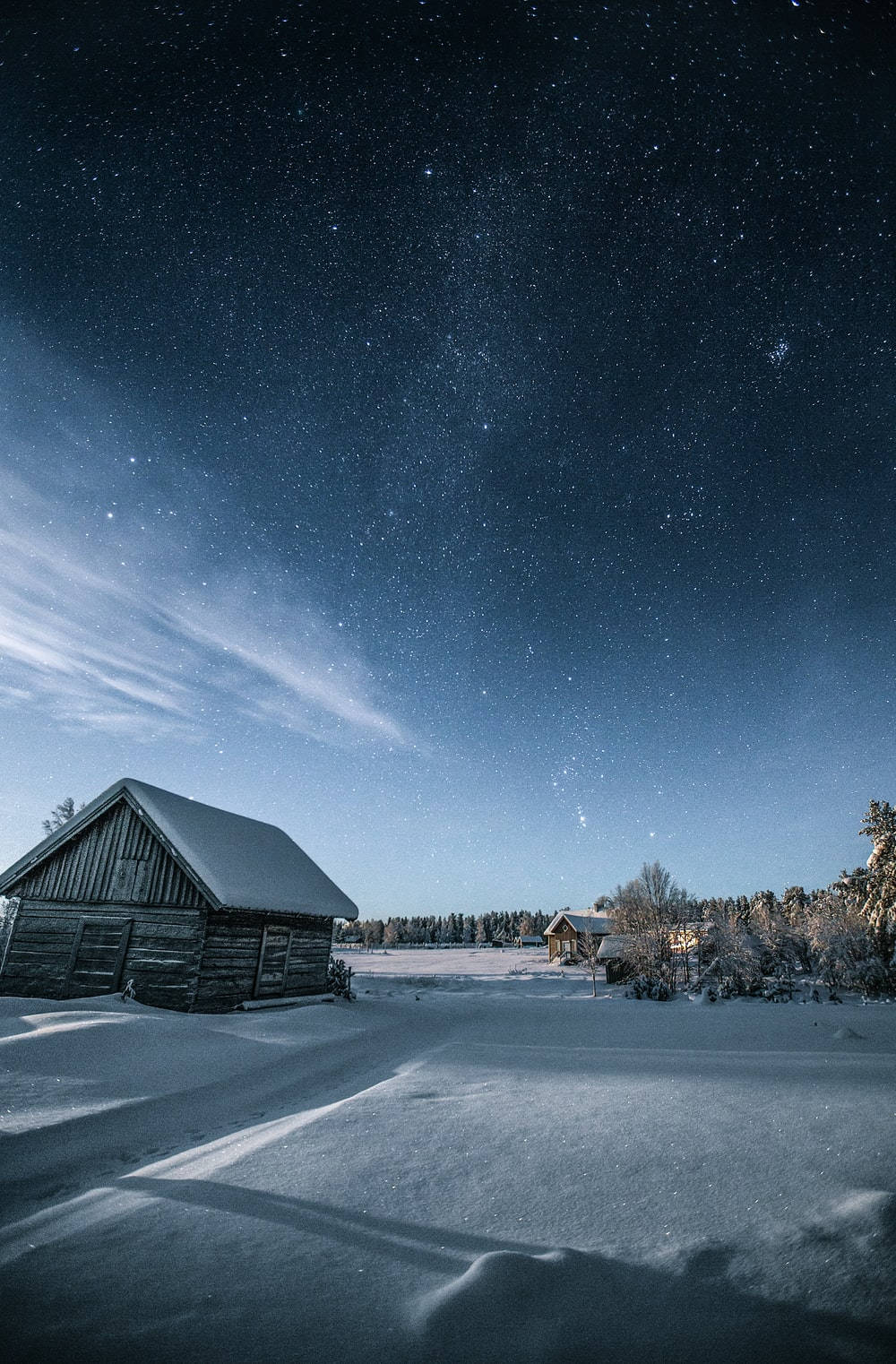 Winter House Under Starry Skies Wallpaper