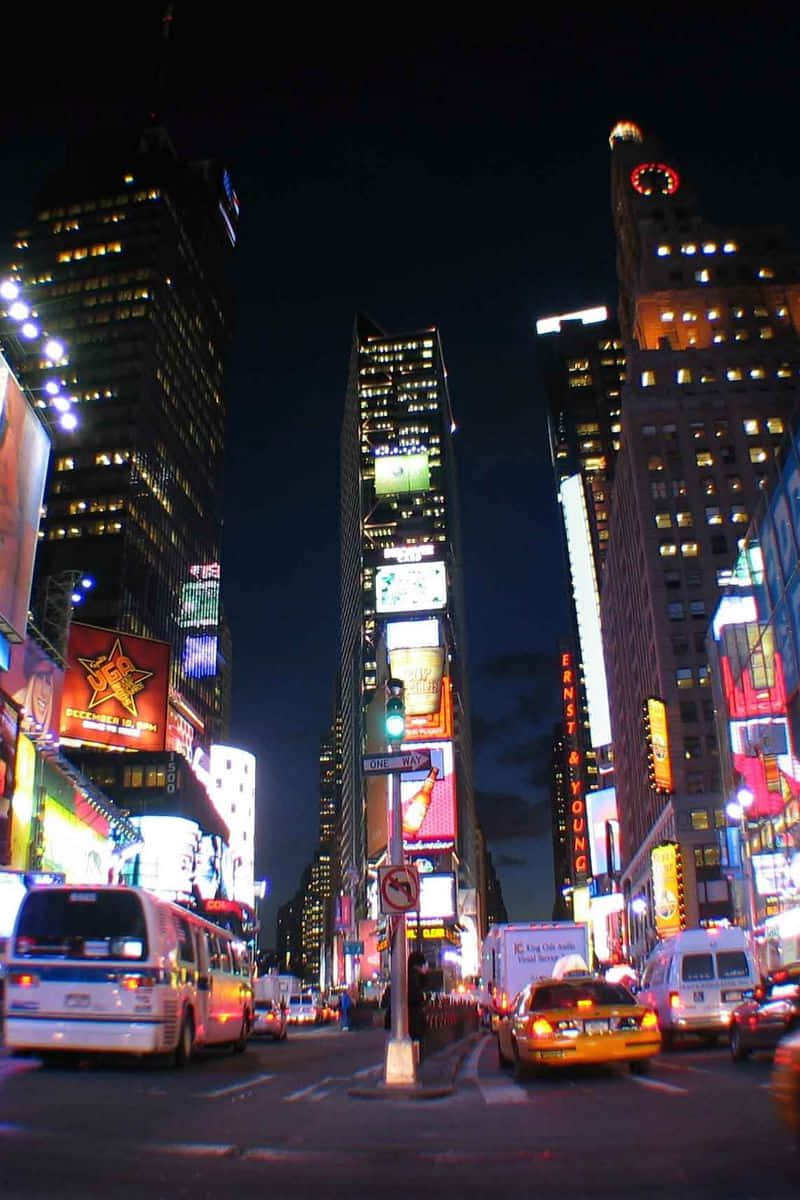 Witness The Beauty Of The New York City Skyline At Night Wallpaper