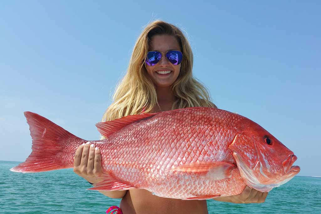 Woman Holding Large Red Snapper Wallpaper