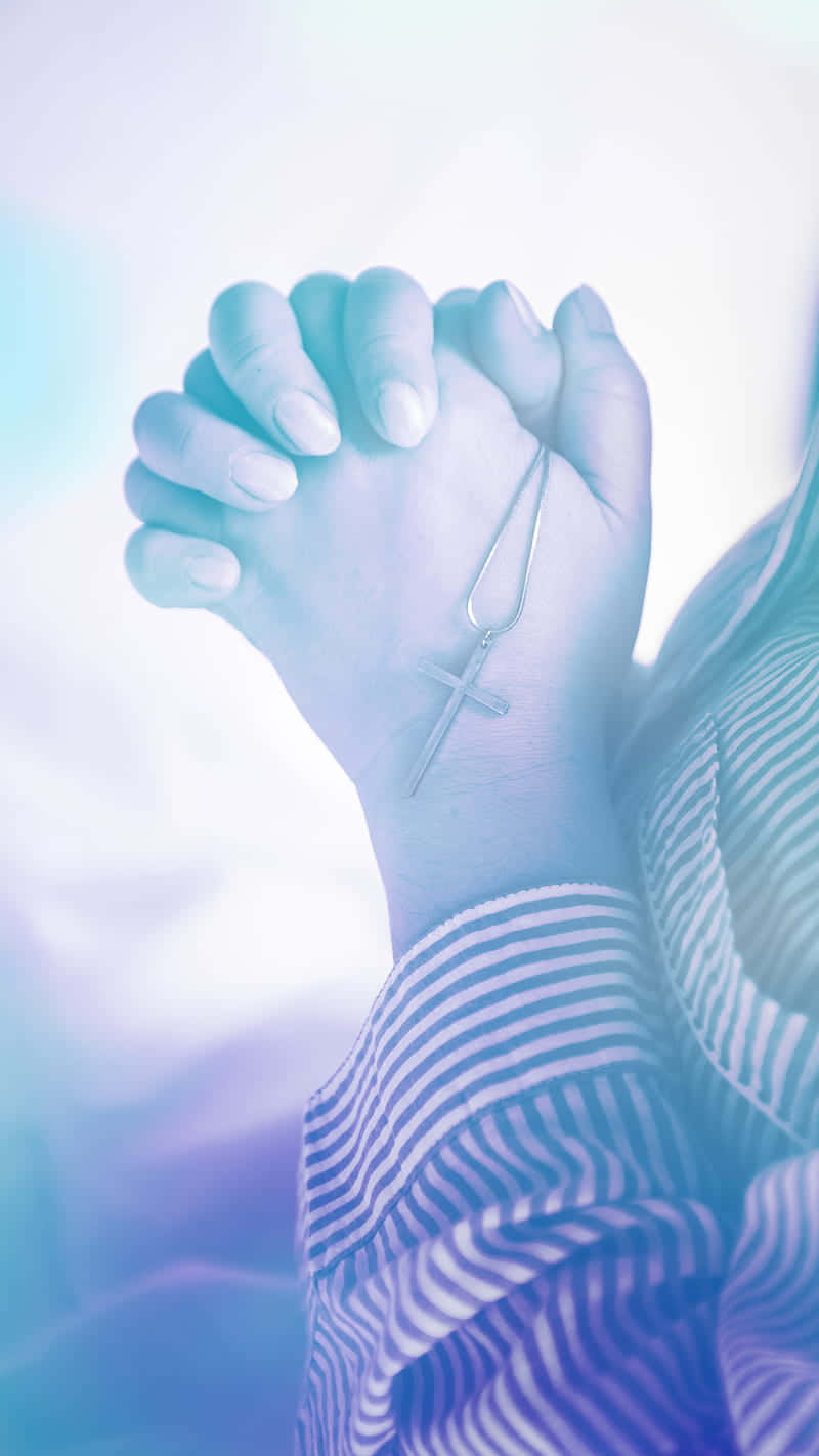 Woman Praying With A Rosary Wallpaper