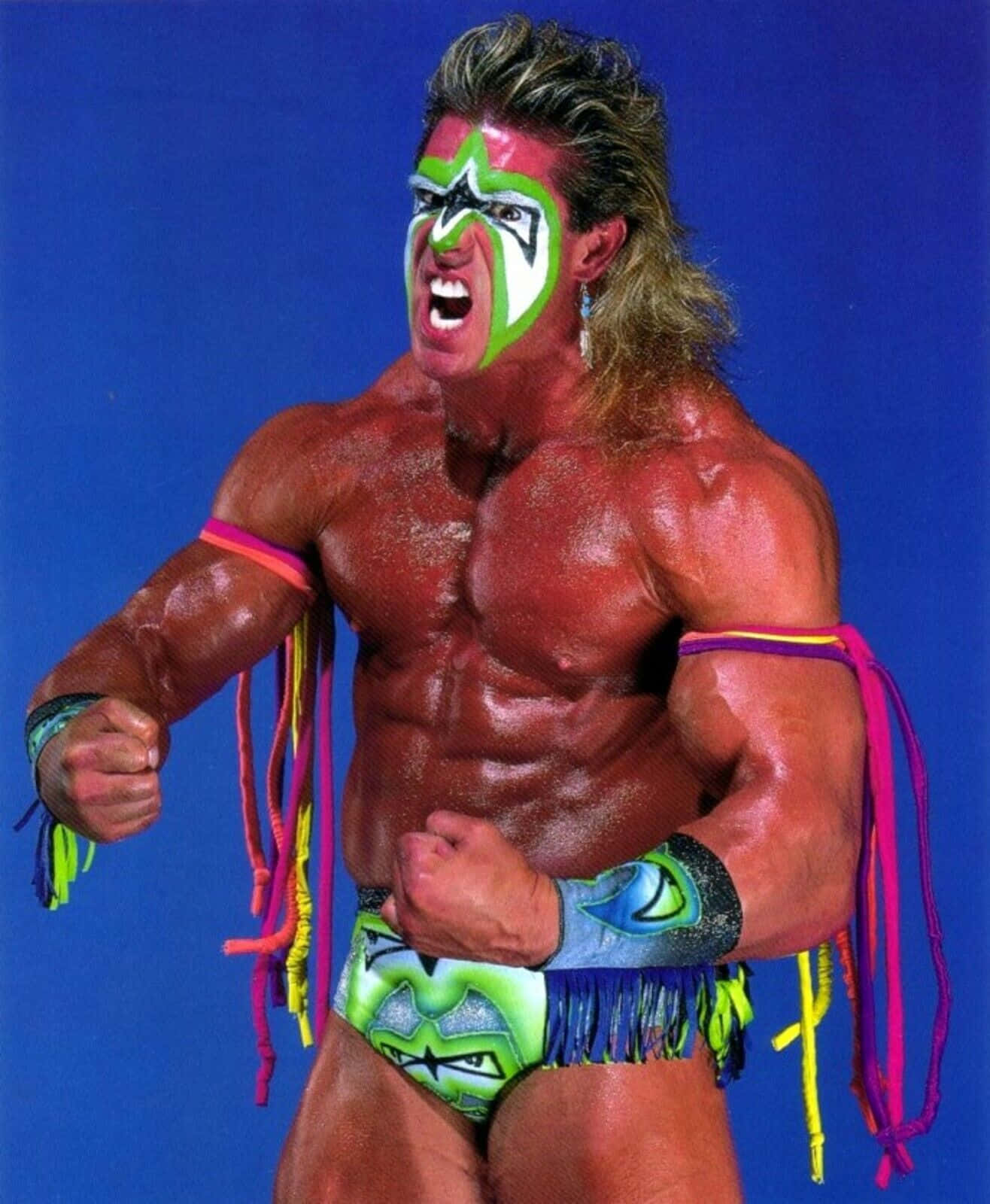 Wwe Legend - The Ultimate Warrior In His Iconic Neon Costume Wallpaper