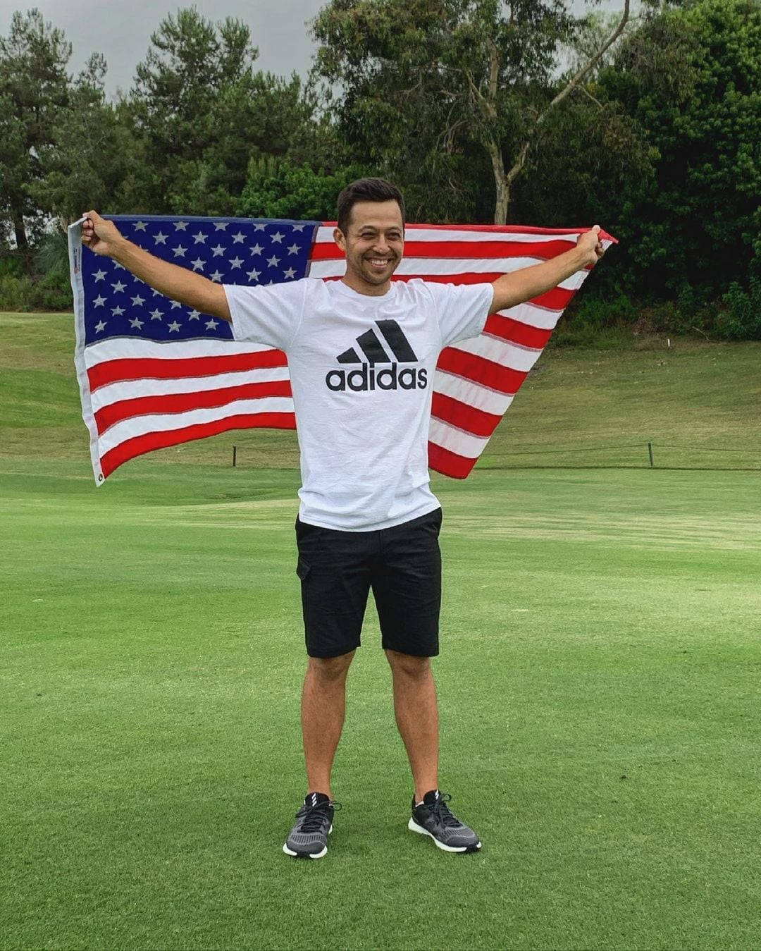 Xander Schauffele Holding A Usa Flag Wallpaper