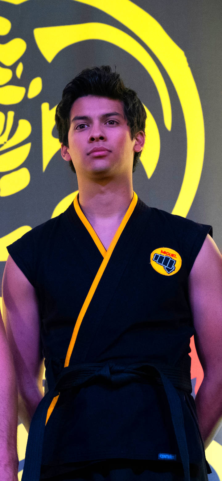 Xolo Maridueña Of Cobra Kai Phone Wallpaper