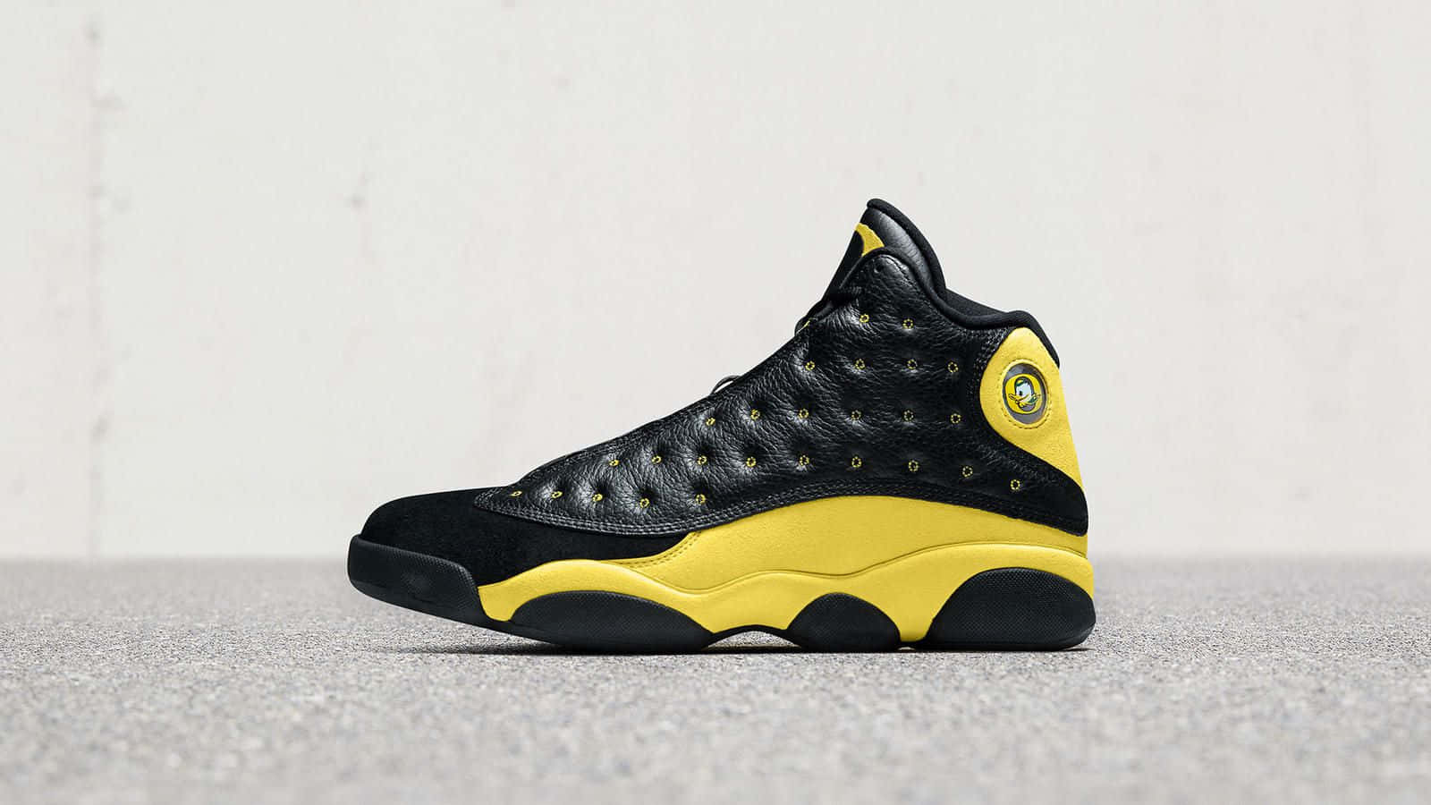 Yellow Jordan School Duck Logo Wallpaper