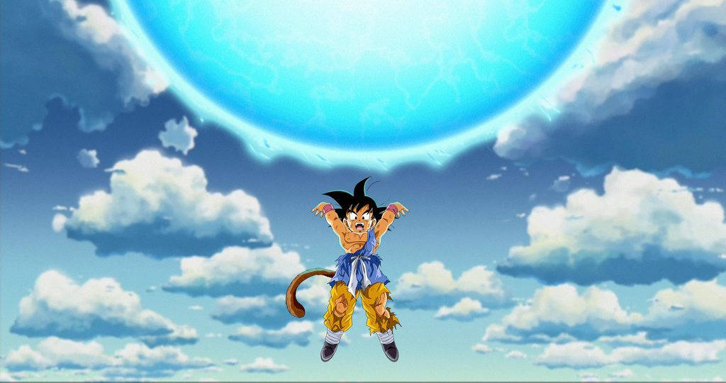 Young Goku With Glowing Spirit Bomb Wallpaper